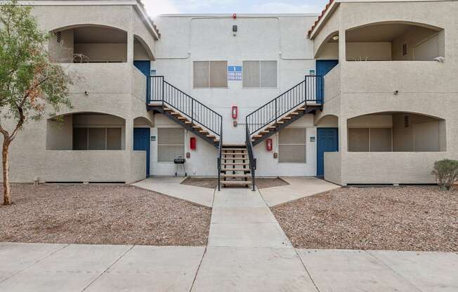 A building with a staircase leading to the second floor.