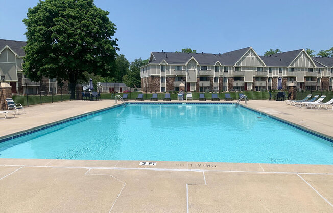 Refreshing Pool With Sundeck at Normandy Village Apartments in Michigan City, IN