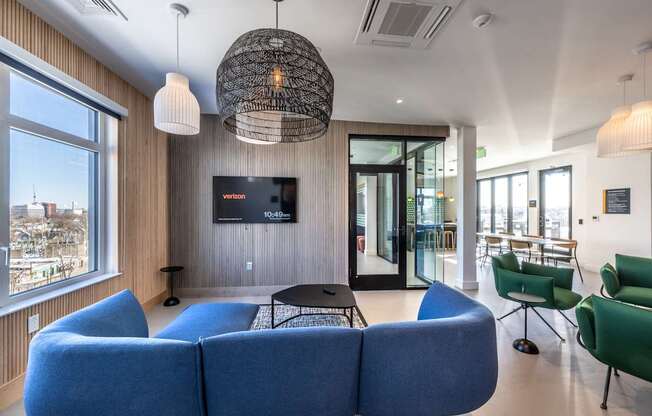 A living room with a blue sofa and a television.