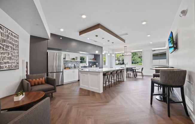 a resident clubhouse with a kitchen and lounge area