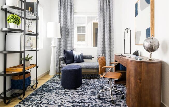 office space with blue rug