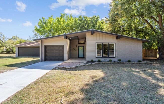 Completely Updated home on nearly 1 acre with 4 car garage!