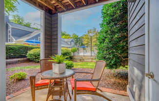 A patio with a table and chairs is shown.