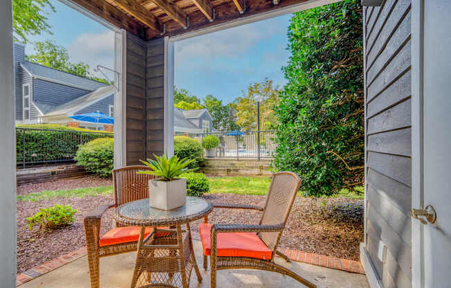 A patio with a table and chairs is shown.