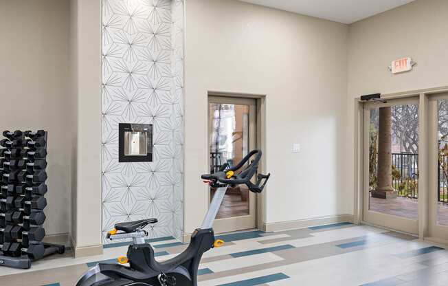 a spin bike in the fitness room at the vue at schiller park