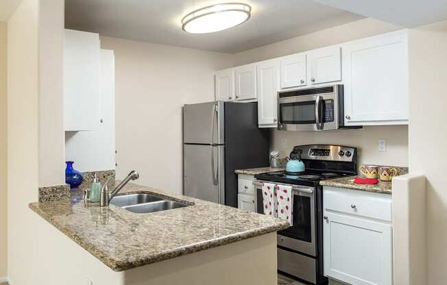 Kitchen Bar With Granite Counter Top at 55+ FountainGlen Rancho Santa Margarita, Rancho Santa Margarita