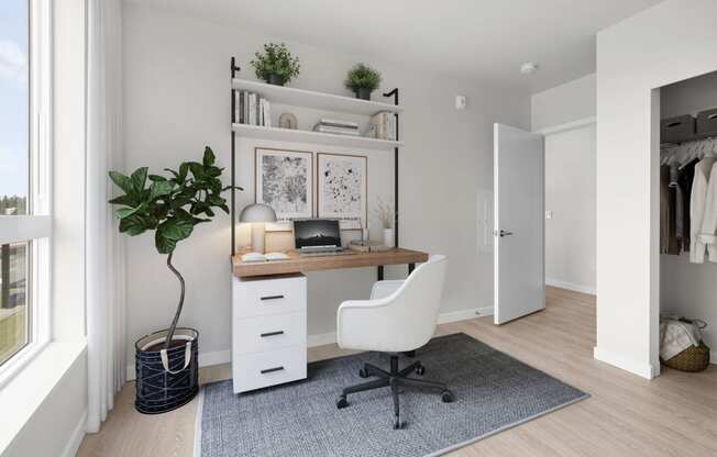 a home office with a desk and a chair in a 555 waverly unit at Ion Town Center, Shoreline, 98133