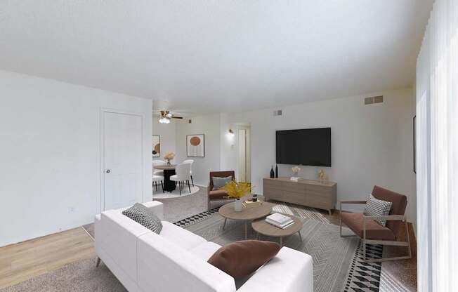 A living room with a white couch and a television.