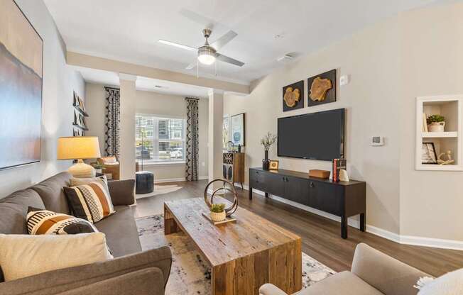 Langley Pointe Apartments | Living Rooms w/ Sunrooms