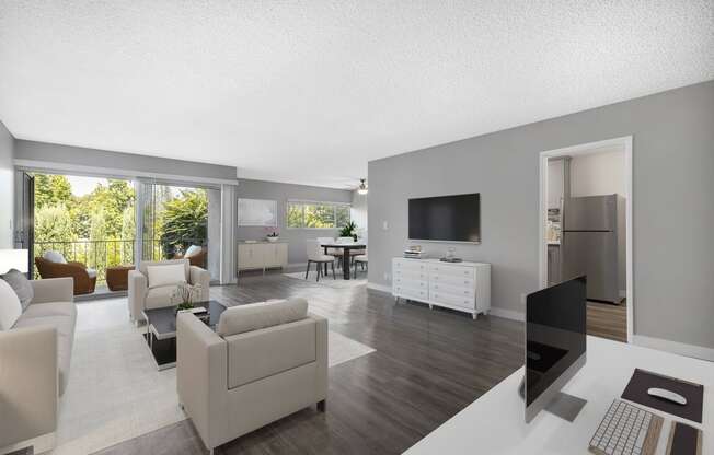 a living room filled with furniture and a flat screen tv