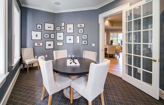 a dining room with a table and chairs