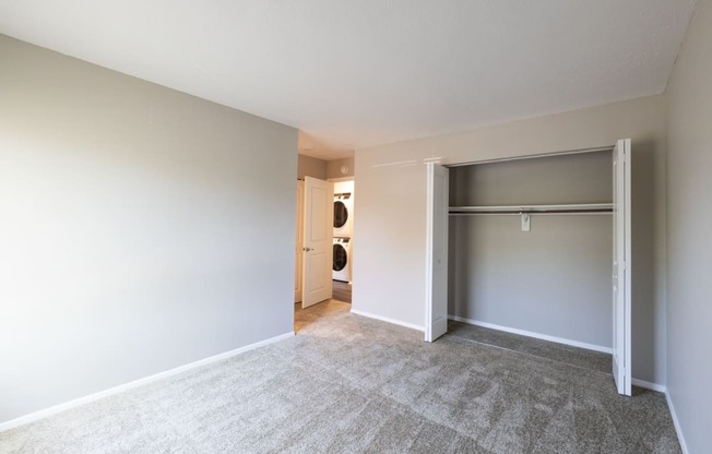 Spacious Primary Bedroom in the Two Bedroom Two Bath Apartment at Woodbridge Apartments Bloomington