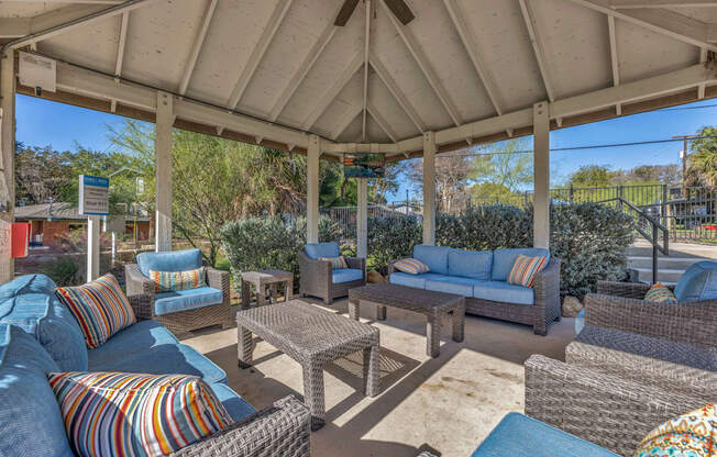 a patio with couches and chairs and a gazebo  at Sunset Ridge, San Antonio, TX