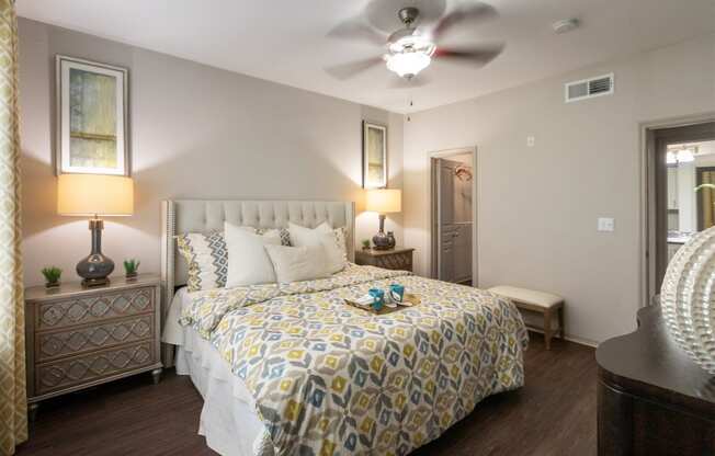 This is a photo of the bedroom of the 826 square foot 1 bedroom apartment at The Brownstones Townhome Apartments in Dallas, TX.