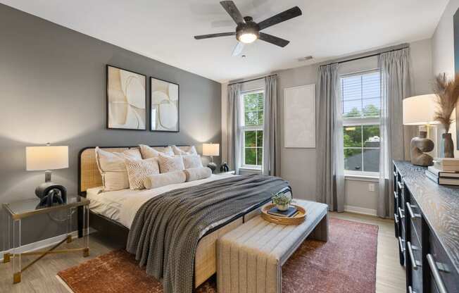 a bedroom with a bed and a ceiling fan at Barclay Chase Apartment Homes, Marlton