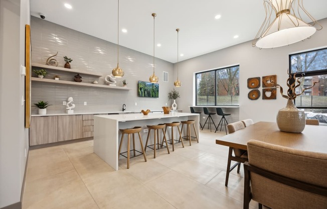 a kitchen and dining area with a table and chairs