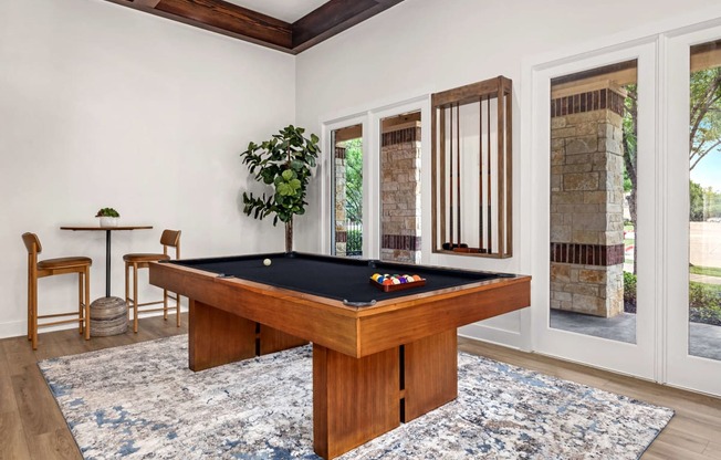 a billiards table in a living room with a pool table