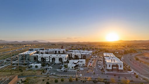 A sunset view of a modern building complex.