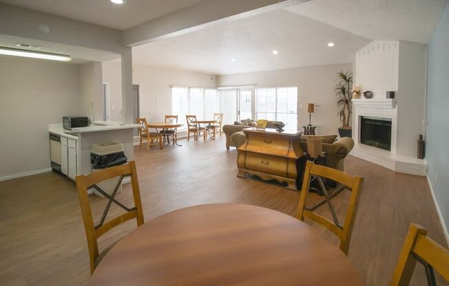 an open living room and dining room with a table and chairs