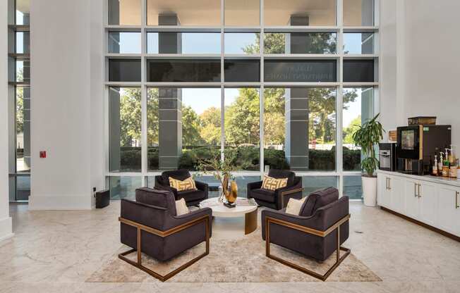 a living room filled with furniture and a large window