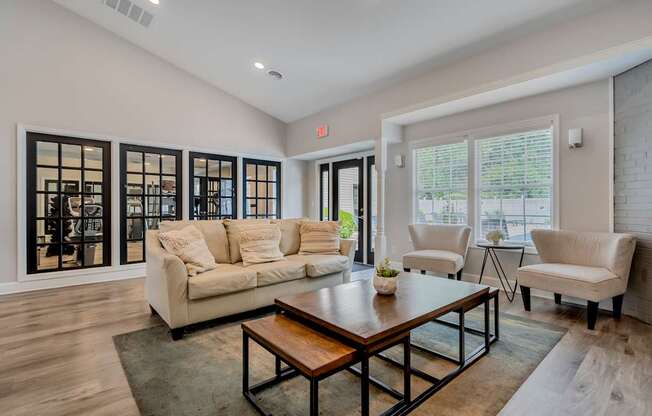 A living room with a white couch and a coffee table.