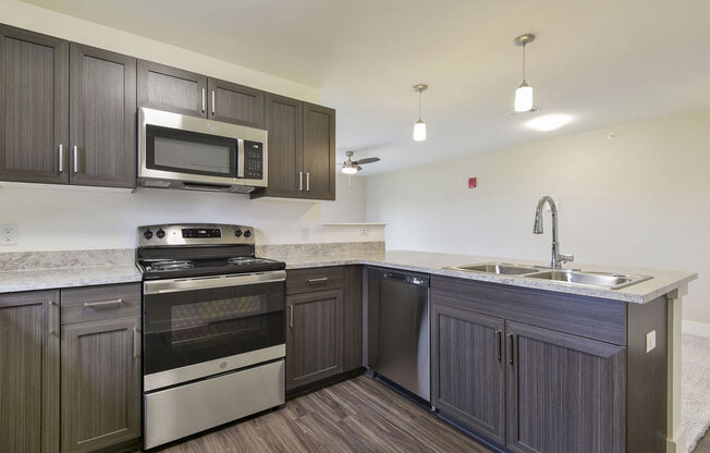 Kitchen with Breakfast Bar at Chase Creek Apartment Homes, Huntsville, AL, 35811