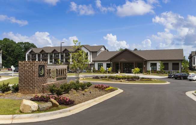 a view of the front of a building with a parking lot