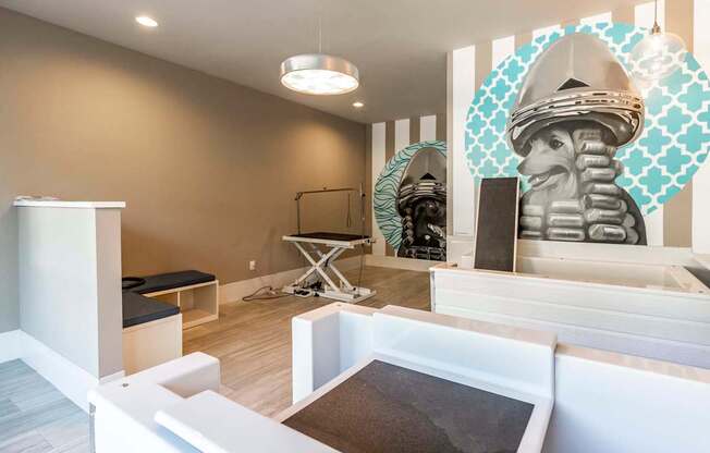 A room with a white bench and a white cabinet.