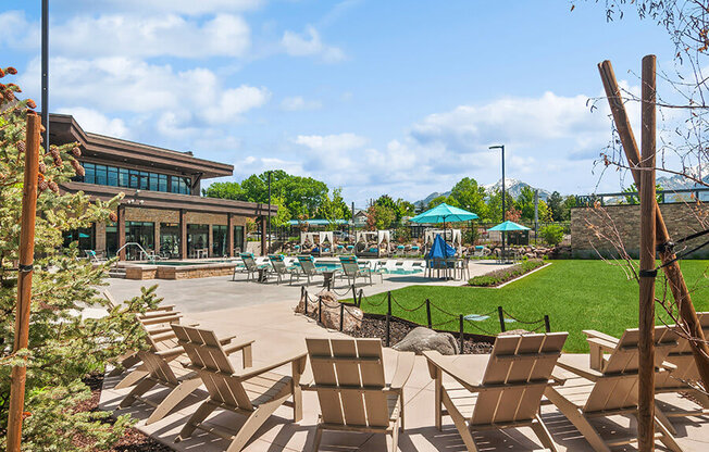 Outdoor Picnic Area with Lounge Furniture and View of Swimming Pool at Seven Skies Apartments located in Sandy, UT.