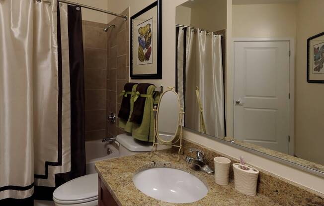 Large Bathrooms With Granite Vanity Tops and Contemporary Lighting