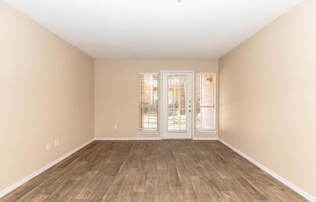 a large empty room with a wooden floor