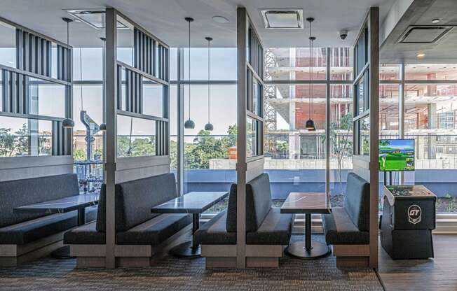 3thirty3 new rochelle ny apartment high rise photo of co-working area with multiple booths and tables for working and conferences