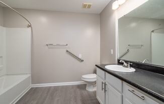 a bathroom with a toilet sink and bathtub