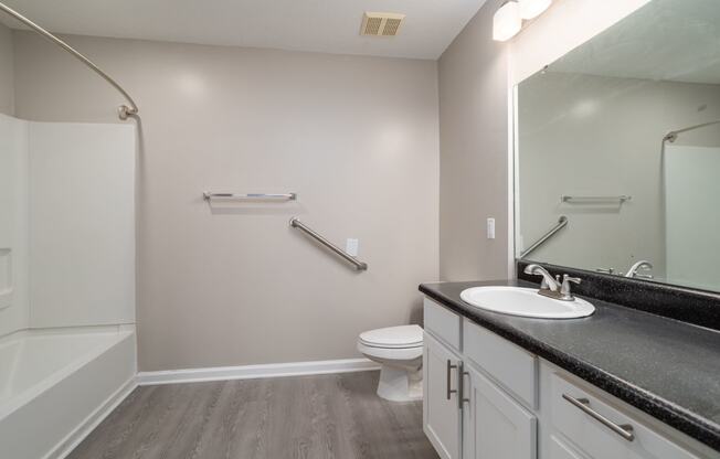 a bathroom with a toilet sink and bathtub