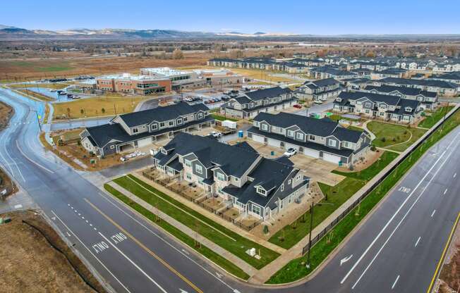 a group of houses sitting on the side of a road