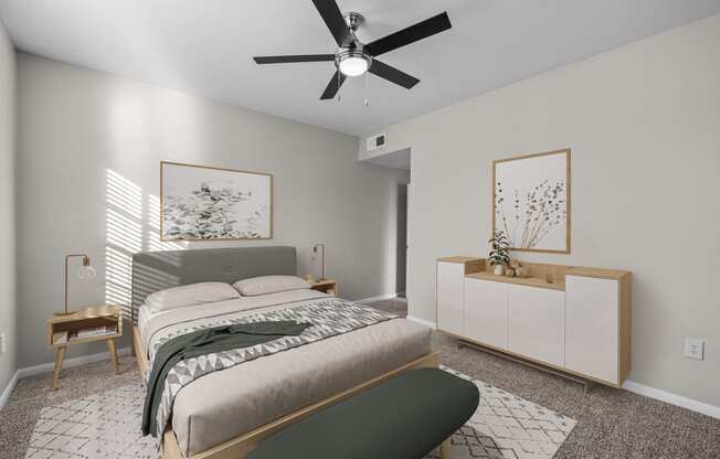 a bedroom with a large bed and a ceiling fan