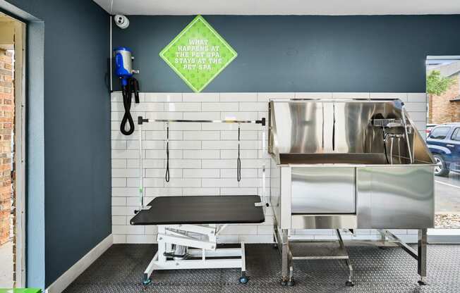 a kitchenette with a sink and a stretcher