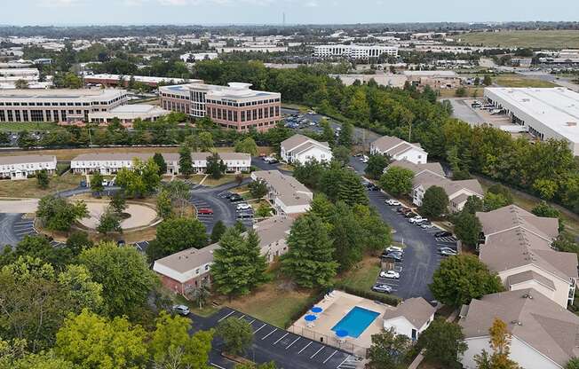 aerial view of apartments with shade trees