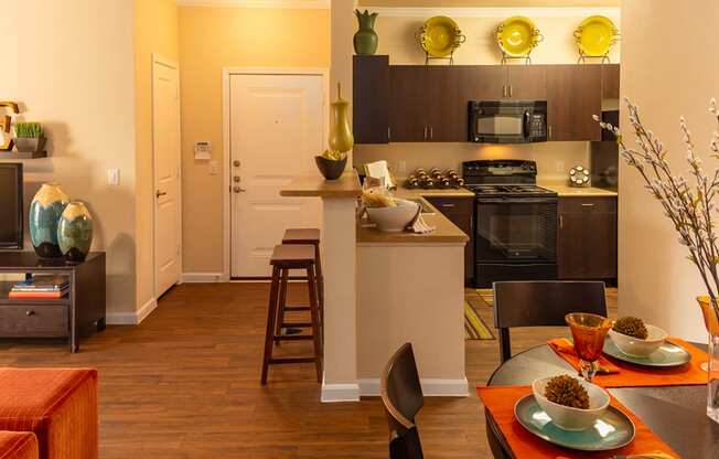 a kitchen and dining area in a 555 waverly unit