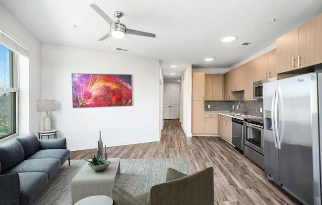A modern kitchen with a refrigerator, oven, and microwave.