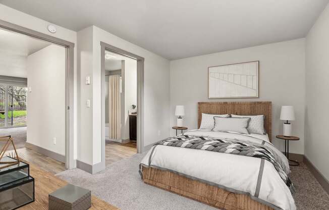 A bedroom with a large bed and a wooden headboard.