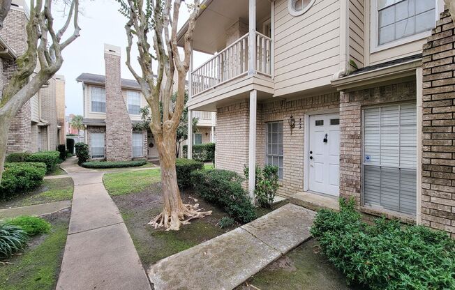 Beautiful two-story corner unit filled with natural light!