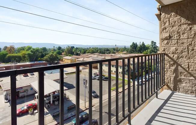 a balcony with a view of a parking lot