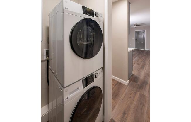 a microwave oven sitting on top of a refrigerator