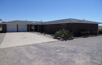 Large Brick Home with Mountain and City Views on Acreage