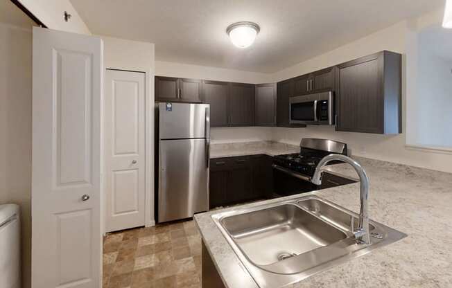 Kitchen with Stainless Steel Appliances Offered at Andover Pointe Apartment Homes, La Vista, 68138