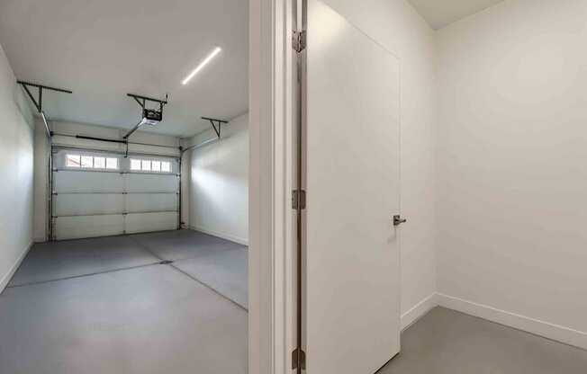 A white room with a door on the right side.