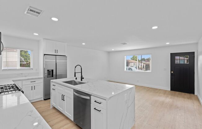 Spacious 4 Bed / 3 Bath Home with Private Driveway, In-Unit Laundry