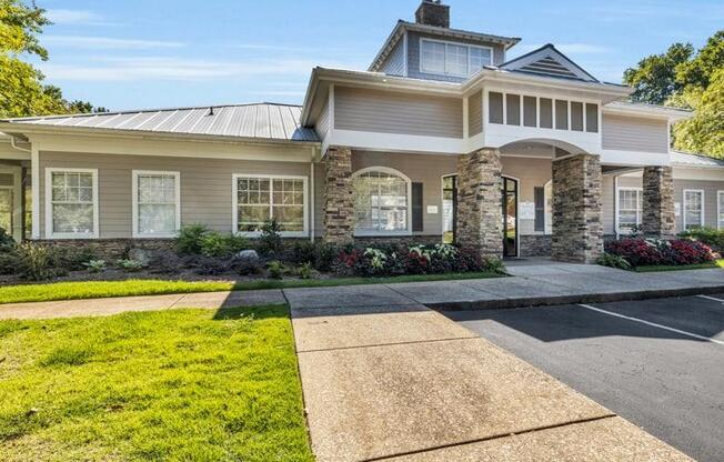 a house with a driveway and lawn in front of it at Marina Point, Tennessee, 37415