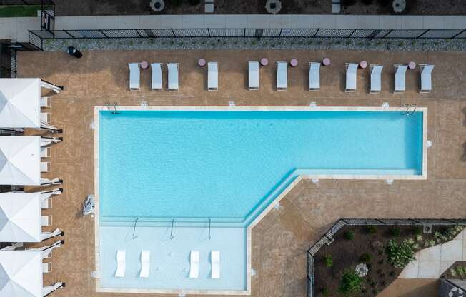 an overhead view of a swimming pool with umbrellas at Preston Ridge, Cary, NC, 27513